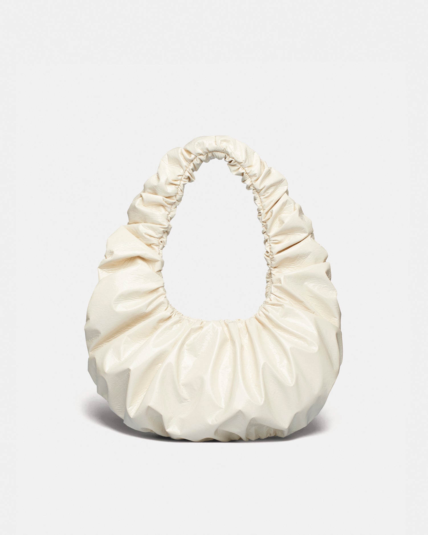 ANJA BAGUETTE - Ruched patent alt-leather shoulder bag - Cream - Nanushka